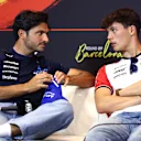 BARCELONA, SPAIN - MAY 29: Carlos Sainz of Spain and Williams and Oliver Bearman of Great Britain and Haas F1 talk in the Drivers Press Conference during previews ahead of the F1 Grand Prix of Spain at Circuit de Barcelona-Catalunya on May 29, 2025 in Barcelona, Spain. (Photo by Clive Rose/Getty Images)
