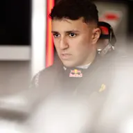 SUZUKA, JAPAN - MARCH 28: Isack Hadjar of France and Oracle Red Bull Racing looks on in the garage