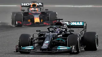 Mercedes' British driver Lewis Hamilton leads Red Bull's Dutch driver Max Verstappen during the