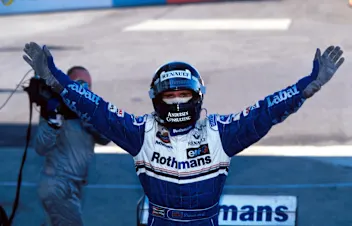 Race winner Damon Hill (GBR) Williams FW18 is able to celebrate his winning of the world