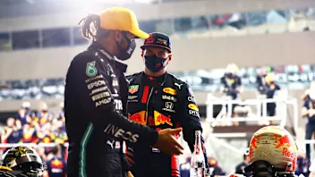 ABU DHABI, UNITED ARAB EMIRATES - DECEMBER 13: Race winner Max Verstappen of Netherlands and Red