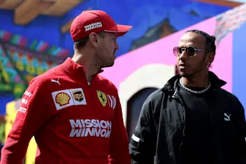 MEXICO CITY, MEXICO - OCTOBER 24: Sebastian Vettel of Germany and Ferrari and Lewis Hamilton of