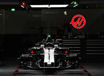 SUZUKA, JAPAN - OCTOBER 07: The car of Kevin Magnussen of Denmark and Haas F1 in the garage after