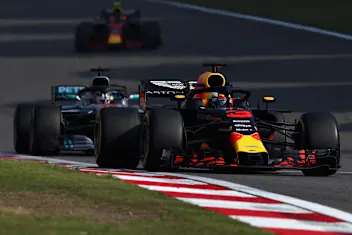 SHANGHAI, CHINA - APRIL 15: Daniel Ricciardo of Australia driving the (3) Aston Martin Red Bull Racing RB14 TAG Heuer leads Lewis Hamilton of Great Britain driving the (44) Mercedes AMG Petronas F1 Team Mercedes WO9 on track during the Formula One Grand Prix of China at Shanghai International Circuit on April 15, 2018 in Shanghai, China.  (Photo by Clive Mason/Getty Images)