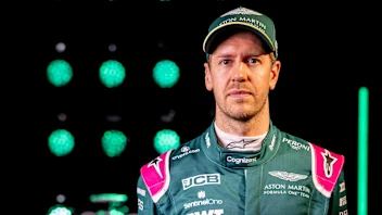 Sebastian Vettel, Aston Martin, in front of the AMR21