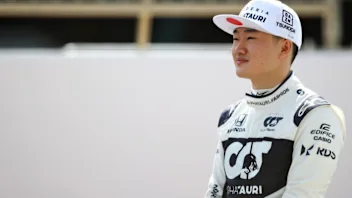 BAHRAIN, BAHRAIN - MARCH 12: Yuki Tsunoda of Japan and Scuderia AlphaTauri looks on from the grid