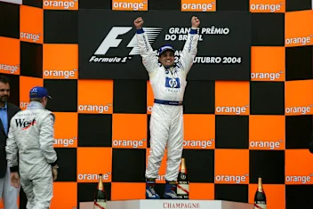 Juan Pablo Montoya (COL) Williams on the podium. Formula One World Championship, Rd18, Brazilian