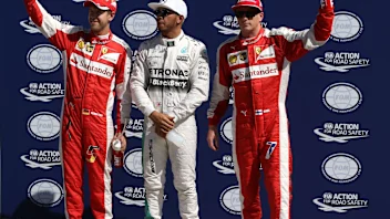 (L to R): Sebastian Vettel (GER) Ferrari, pole sitter Lewis Hamilton (GBR) Mercedes AMG F1 and Kimi