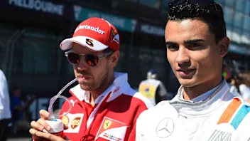 Sebastian Vettel (GER) Ferrari and Pascal Wehrlein (GER) Manor Racing on the grid at Formula One