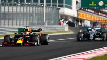 HUNGARORING, HUNGARY - AUGUST 04: Max Verstappen, Red Bull Racing RB15, leads Lewis Hamilton,