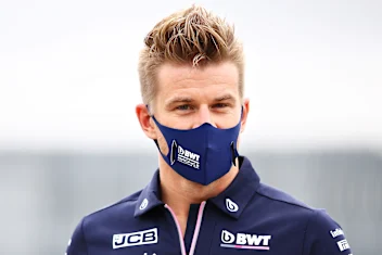 NORTHAMPTON, ENGLAND - AUGUST 01: Nico Hulkenberg of Germany and Racing Point walks in the Paddock