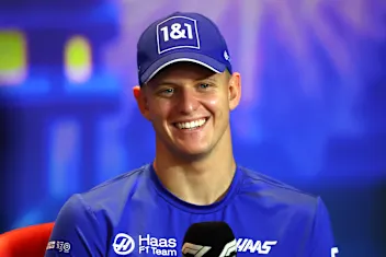 ABU DHABI, UNITED ARAB EMIRATES - NOVEMBER 17: Mick Schumacher of Germany and Haas F1 talks in a