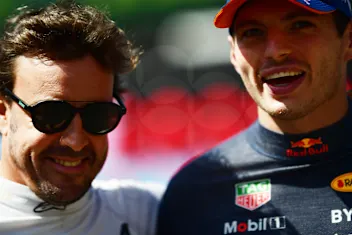 SPA, BELGIUM - AUGUST 28: Fernando Alonso of Spain and Alpine F1 talks to Max Verstappen of the