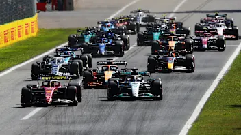 MONZA, ITALY - SEPTEMBER 11: Charles Leclerc of Monaco driving the (16) Ferrari F1-75 leads George