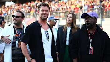 ABU DHABI, UNITED ARAB EMIRATES - NOVEMBER 26: Chris Hemsworth and will.i.am interact on the grid