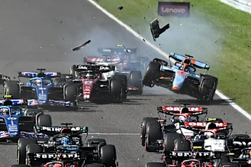 TOPSHOT - Williams' Thai driver Alexander Albon (back, R) collides with Alfa Romeo's Finnish driver