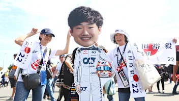 SUZUKA, JAPAN - SEPTEMBER 24: Fans show their support of Yuki Tsunoda of Japan and Scuderia