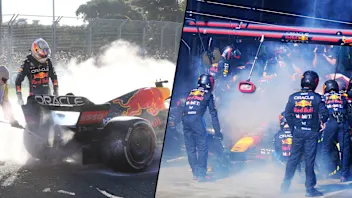 Red Bull Racing's Dutch driver Max Verstappen (C) comes out after smoke billowing from his car
