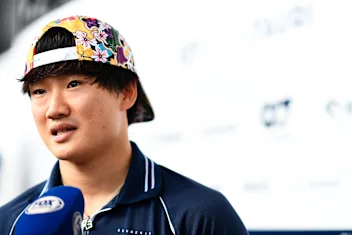 SUZUKA, JAPAN - SEPTEMBER 21: Yuki Tsunoda of Japan and Scuderia AlphaTauri talks to the media in