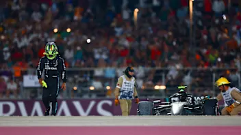 LUSAIL CITY, QATAR - OCTOBER 08: Lewis Hamilton of Great Britain and Mercedes looks on after