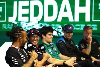 JEDDAH, SAUDI ARABIA - MARCH 16: Sergio Perez of Mexico and Oracle Red Bull Racing talks with Lewis