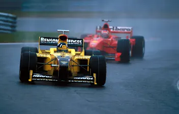 Race winner Damon Hill (GBR) Jordan 198 holds off Michael Schumacher (GER) Ferrari F300 early in