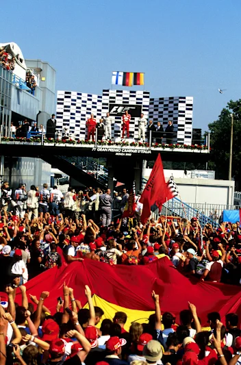 The Tifosi go crazy at Michael Schumacher(GER) Ferrari F1 2000 on the podium Italian GP, Monza, 10
