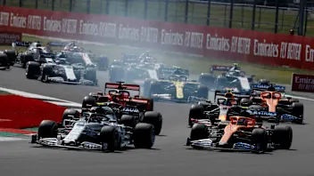 Drivers take the first corner at the start of the 70th Anniversary Formula One Grand Prix at the