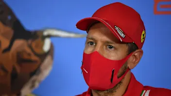 Ferrari driver Sebastian Vettel of Germany speaks during drivers news conference the at the Red
