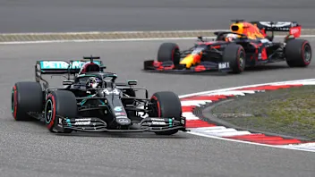 Mercedes driver Lewis Hamilton of Britain leads Red Bull driver Max Verstappen of the Netherlands