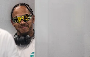SINGAPORE, SINGAPORE - SEPTEMBER 20: Lewis Hamilton of Great Britain and Mercedes GP looks on in