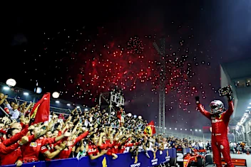 SINGAPORE, SINGAPORE - SEPTEMBER 22: Race winner Sebastian Vettel of Germany and Ferrari celebrates