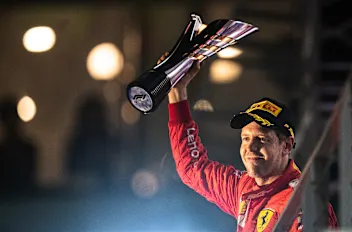 SINGAPORE, SINGAPORE - SEPTEMBER 22: Race winner Sebastian Vettel of Germany and Ferrari celebrates