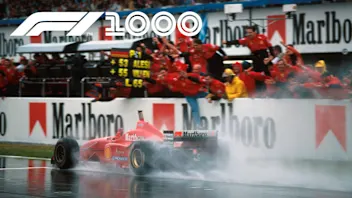 Race winner Michael Schumacher (GER) Ferrari F310 takes the adulation of his team from the pit wall