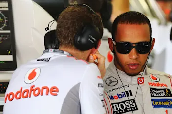 SUZUKA, JAPAN - OCTOBER 05:  Lewis Hamilton of Great Britain and McLaren talks with his performance