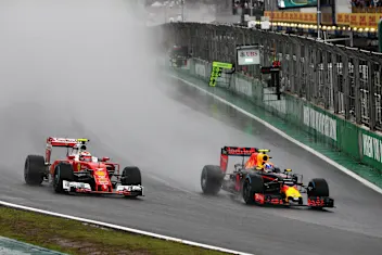 SAO PAULO, BRAZIL - NOVEMBER 13:  Max Verstappen of the Netherlands driving the (33) Red Bull Racing Red Bull-TAG Heuer RB12 TAG Heuer overtakes Kimi Raikkonen of Finland driving the (7) Scuderia Ferrari SF16-H Ferrari 059/5 turbo (Shell GP) on track during the Formula One Grand Prix of Brazil at Autodromo Jose Carlos Pace on November 13, 2016 in Sao Paulo, Brazil.  (Photo by Mark Thompson/Getty Images)