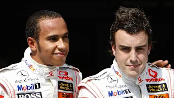 Spanish McLaren-Mercedes driver Fernando Alonso (R) and British McLaren-Mercedes driver Lewis
