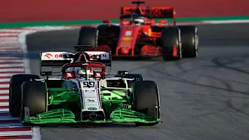 Alfa Romeo's Italian driver Antonio Giovinazzi drives ahead of Ferrari's German driver Sebastian