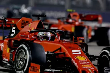 SINGAPORE, SINGAPORE - SEPTEMBER 22: Sebastian Vettel of Germany driving the (5) Scuderia Ferrari