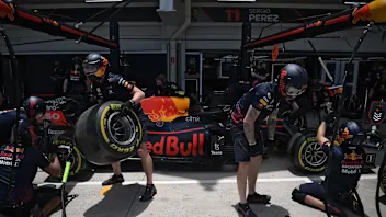 Members of Red Bull's pit crew work during the free practice second session at the Autodromo Jose