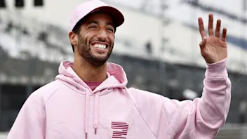 McLaren's Australian-Italian Formula One driver Daniel Ricciardo waves as he arrives at the track