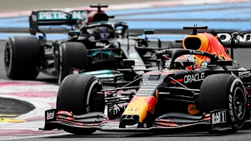 Red Bull's Dutch driver Max Verstappen drives ahead of Mercedes' British driver Lewis Hamilton