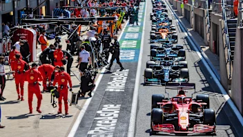 Charles Leclerc (MON) Ferrari SF-21 in the pits while the race is