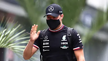 SOCHI, RUSSIA - SEPTEMBER 23: Valtteri Bottas of Finland and Mercedes GP walks in the Paddock