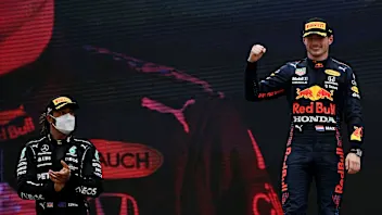 Winner Red Bull's Dutch driver Max Verstappen celebrates as second-placed Mercedes' British driver