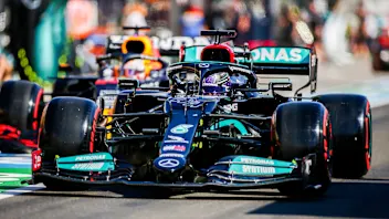 BUDAPEST, HUNGARY - JULY 31: Lewis Hamilton of Mercedes and Great Britain leads Max Verstappen of