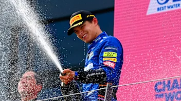 Lando Norris, McLaren, 3rd position, sprays Champagne from the