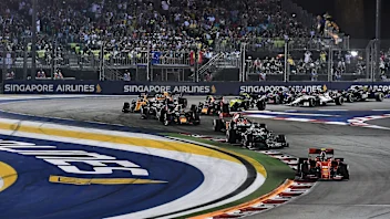Ferrari's Monegasque driver Charles Leclerc (bottom R) leads the pack during the Formula One