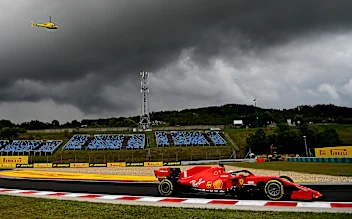 BUDAPEST, HUNGARY - JULY 19: Sebastian Vettel of Germany driving the (5) Scuderia Ferrari SF1000 on