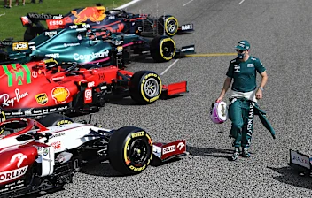 BAHRAIN, BAHRAIN - MARCH 12: Sebastian Vettel of Germany and Aston Martin walks amongst the cars on